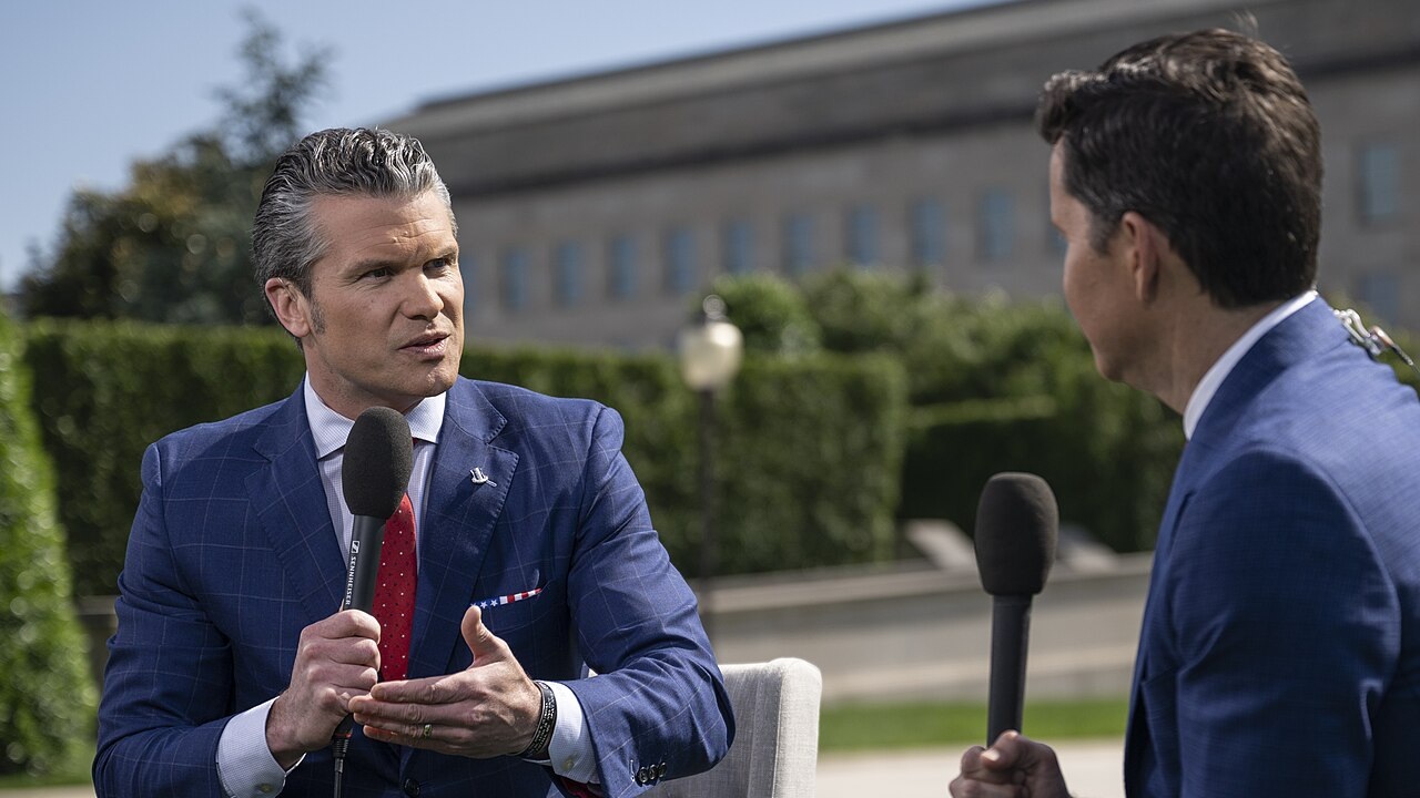 Secretary of Defense Pete Hegseth giving an interview outside the Pentagon.