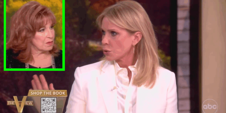 Two women speaking on a talk show, one in a white blazer and the other with red hair, discussing a topic with animated expressions.