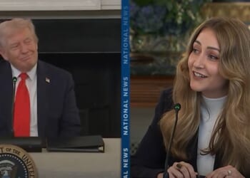 Donald Trump and a woman speaking during a discussion at a presidential event, both engaged and smiling, emphasizing a collaborative atmosphere.