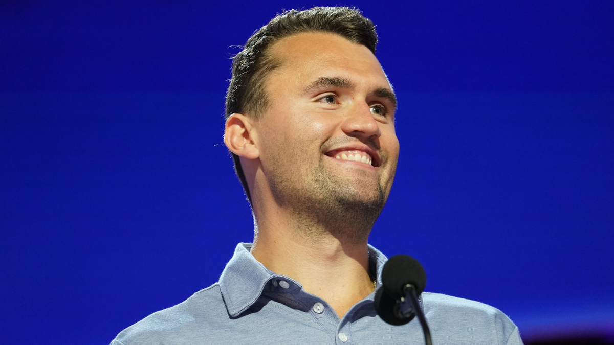 Charlie Kirk smiles onstage ahead of the Republican National Convention.
