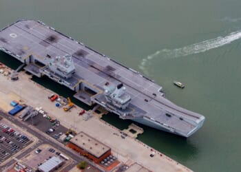 The HMS Prince of Wales at a dock.