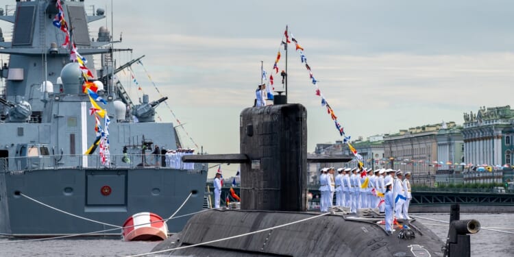 The crew on board the diesel-electric submarine St. Petersburg in the waters of the Neva River during the Main Naval Parade.