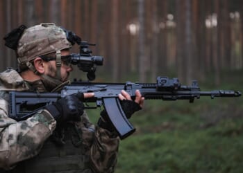 A soldier carrying an AK-12 rifle.