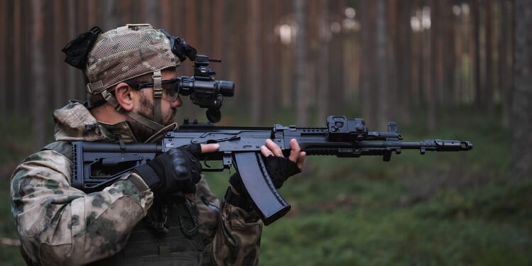 A soldier carrying an AK-12 rifle.