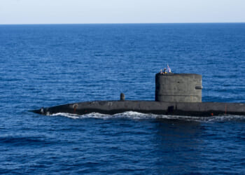 The Royal Navy Trafalager-class nuclear submarine HMS Talent (S92) participates in a coordinated anti-submarine warfare exercise.