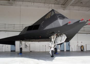 An F-117 Nighthawk in a hangar.