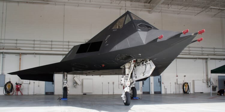 An F-117 Nighthawk in a hangar.