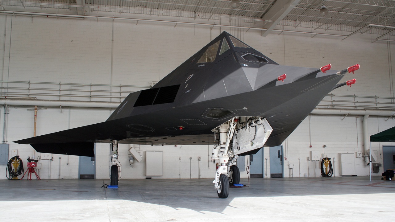 An F-117 Nighthawk in a hangar.