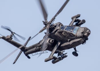 Apache military helicopter in action.