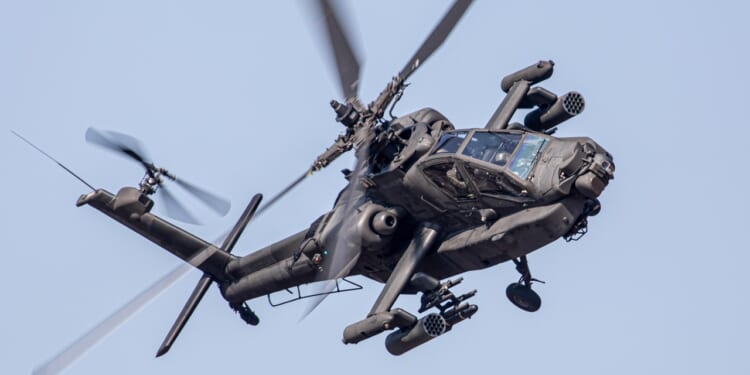 Apache military helicopter in action.