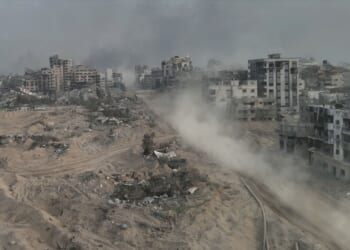 Dust rises from ruins in Gaza.