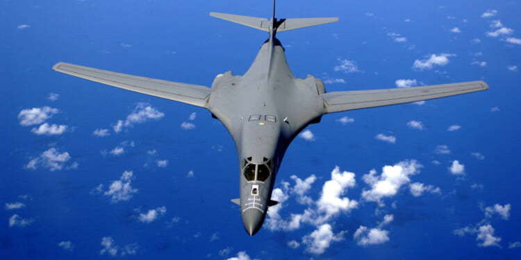 A B-1B Lancer soars over the Pacific Ocean as it maneuvers in for aerial refueling by a KC-135 Stratotanker on Sept. 30, 2005.