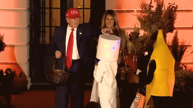 Trump places candy on trick-or-treater's head