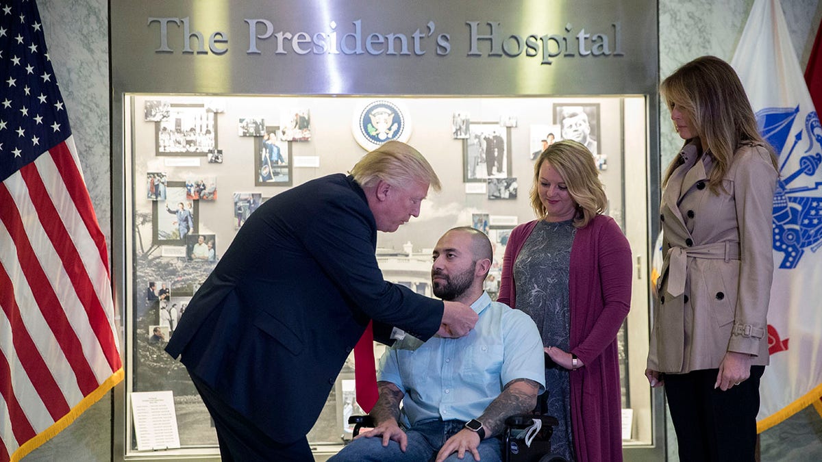 President Trump awarding a sergeant a Purple Heart at Walter Reed