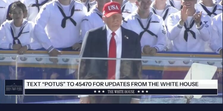 Former President Donald Trump speaks at an event with a crowd of sailors, promoting updates from the White House via text.