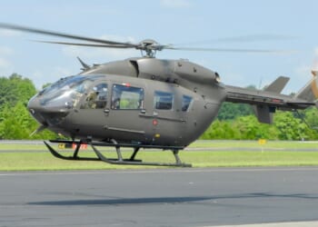 A UH-72 Lakota helicopter taking off.