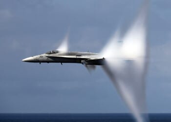 An F/A-18 Hornet breaking the sound barrier.