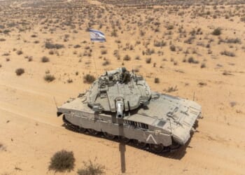 A Merkava tank with an Israeli flag.