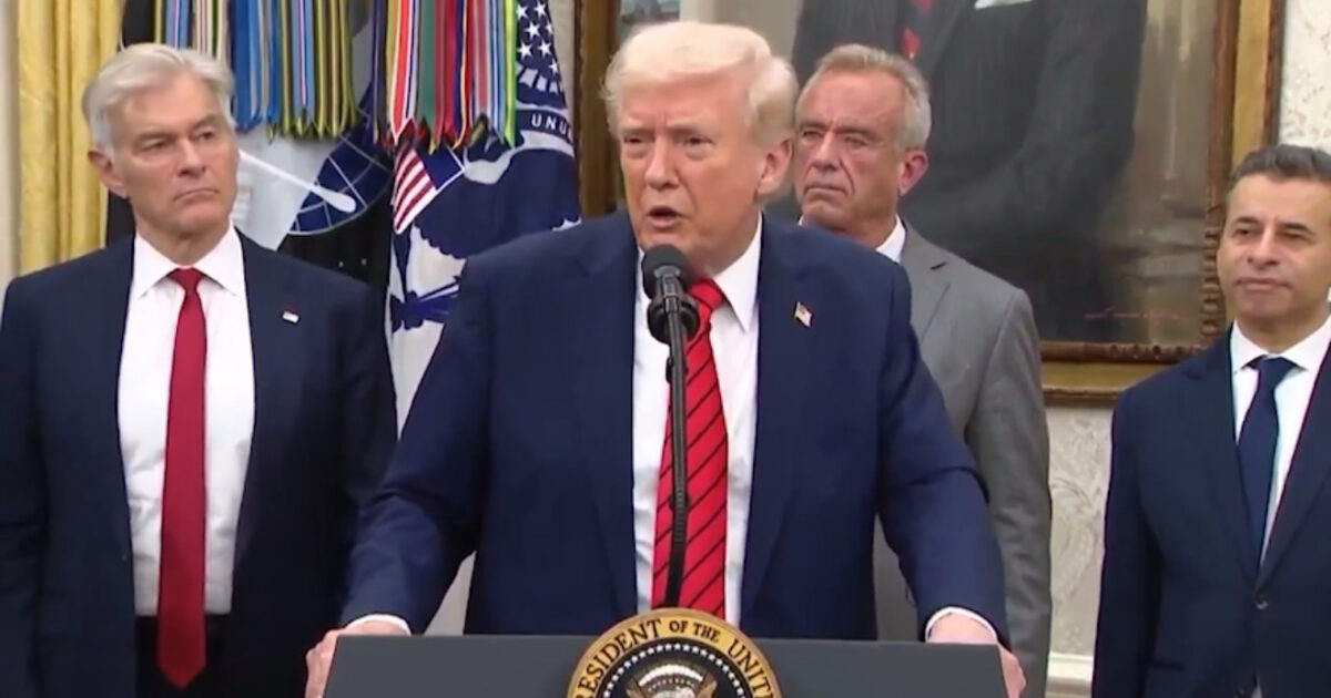 Donald Trump speaks at a podium in the Oval Office, flanked by advisors, during a press event highlighting key policies and initiatives.