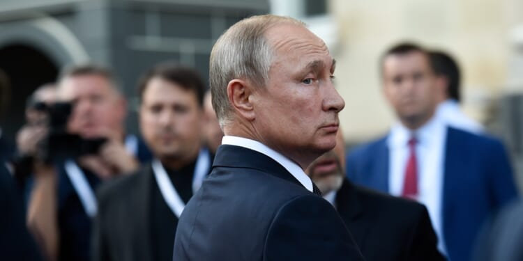 Vladimir Putin looking over his shoulder.