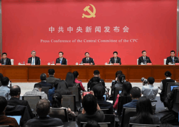 Press conference of the Central Committee of the Communist Party of China, featuring officials and journalists in attendance.