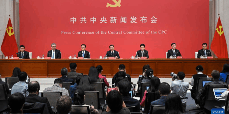 Press conference of the Central Committee of the Communist Party of China, featuring officials and journalists in attendance.