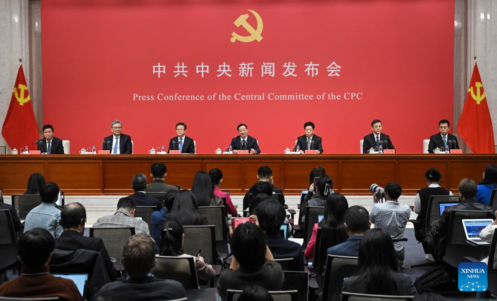 Press conference of the Central Committee of the Communist Party of China, featuring officials and journalists in attendance.