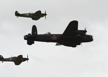 World War II-era planes flying in formation.