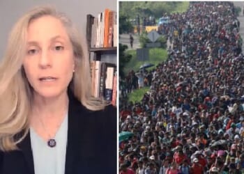 Woman speaking on immigration issues alongside a large crowd of migrants walking along a road, highlighting the ongoing migration crisis.