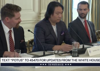 Discussion at the White House featuring three men at a table, focusing on policy updates and initiatives.