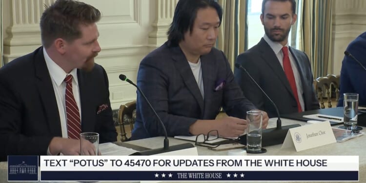 Discussion at the White House featuring three men at a table, focusing on policy updates and initiatives.