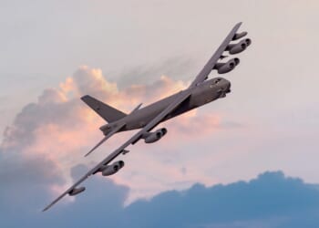 A B-52 Stratofortress turning at dusk.