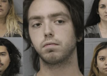 Half-naked woman 'missing flesh' and handcuffed in backyard was tortured for weeks, beaten with bat, shot with BB gun: Cops