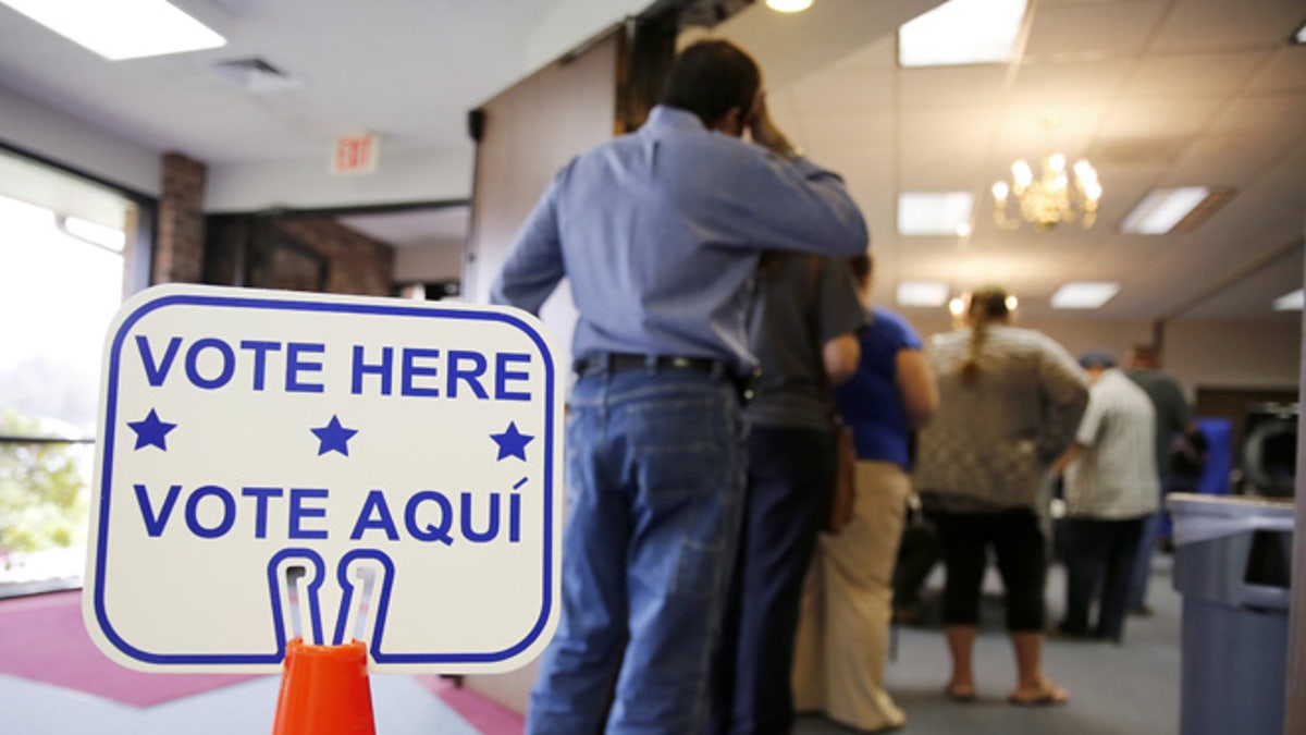 ROSENBERG, TEXAS - MARCH 1: Voters stand in line to cast their ballots inside Calvary Baptist Church March 1, 2016 in Rosenberg, Texas. Voters in 12 states go to the polls in today's Super Tuesday. (Photo by Erich Schlegel/Getty Images)