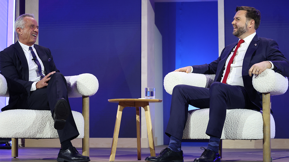 (L/R) US Secretary of Health and Human Services Robert F. Kennedy Jr. and Vice President JD Vance speak during the Make America Healthy Again (MAHA) summit in Washington, DC, on November 12, 2025.