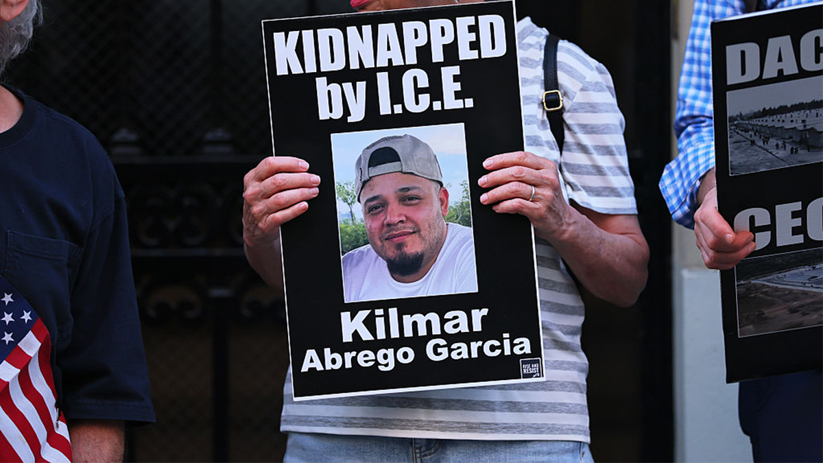 A protester holds a photo of Maryland man Kilmar Abrego Garcia.