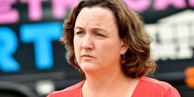 Katie Porter slams Tom Steyer over big-money ties — after cashing his checks