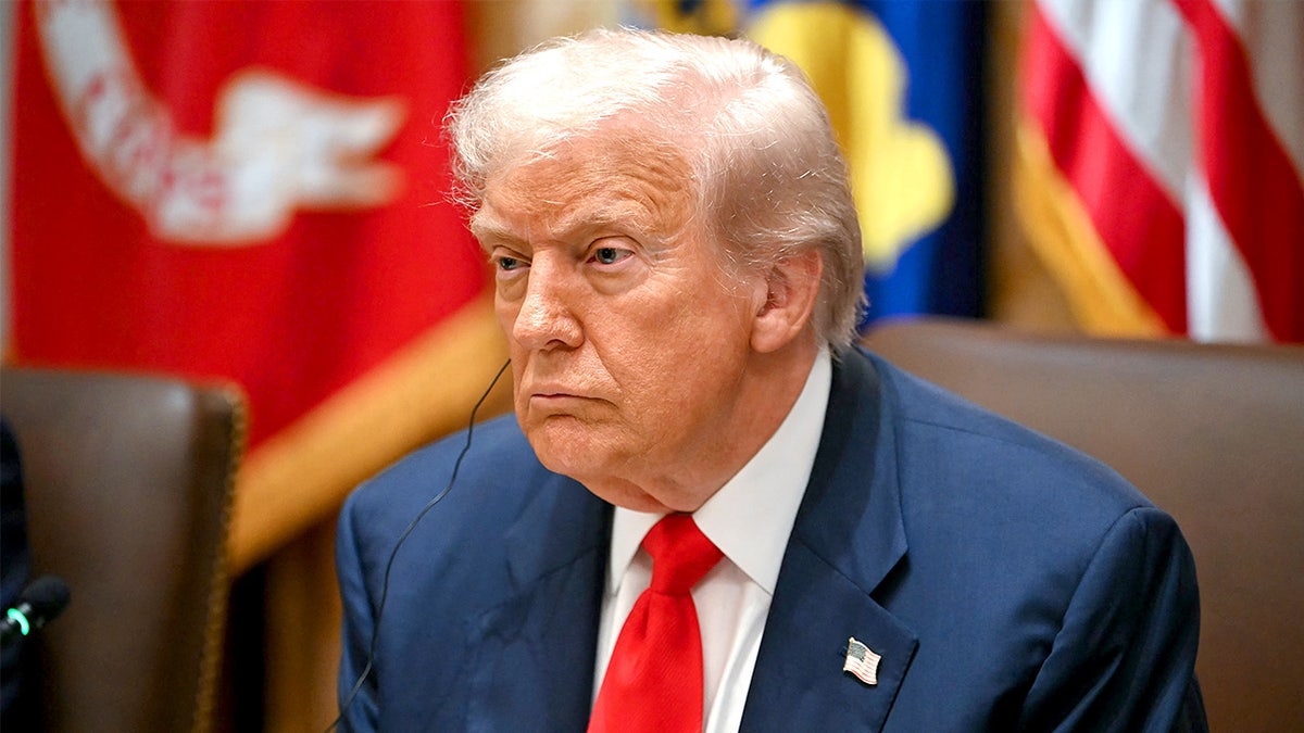 President Donald Trump listens during remarks by Argentina’s President Javier Milei in the White House Cabinet Room.
