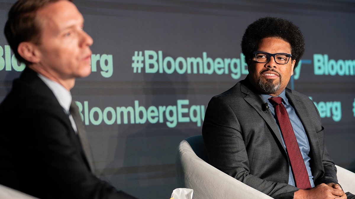 Darrick Hamilton, professor at the New School (right) speaks during the Bloomberg Equality Summit in New York, March 22, 2022.