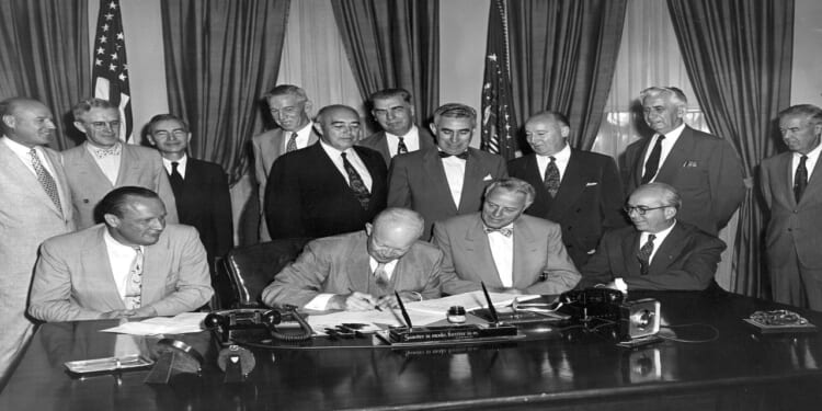 President Eisenhower signs H.R. 9757, an act "to amend the Atomic Energy Act of 1946."
