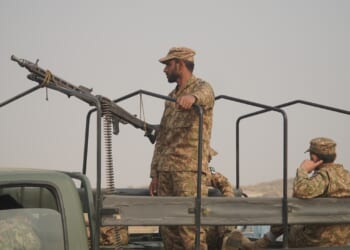 A Pakistani soldier manning a machine gun.