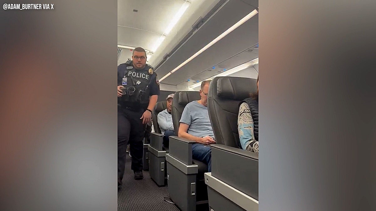 Woman escorted off American Airlines plane