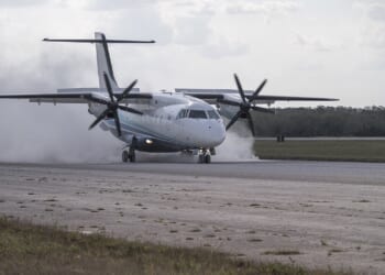 A C-146 Wolfhound landing on an airstrip.