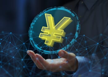 JPY stablecoin or digital yen. Cryptocurrency tokens on blockchain networks. Business person holding yen sign.