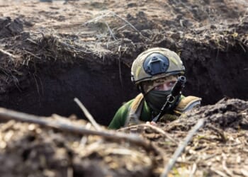 A Ukrainian Armed Forces soldier is seen with a rifle in a trench at a combat position during a combat mission in Donetsk region, Ukraine.