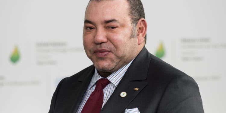 King Mohammed VI of Morocco appears at Paris COP21 conference.
