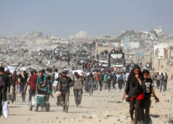 Palestinians head to an aid distribution center in Gaza.