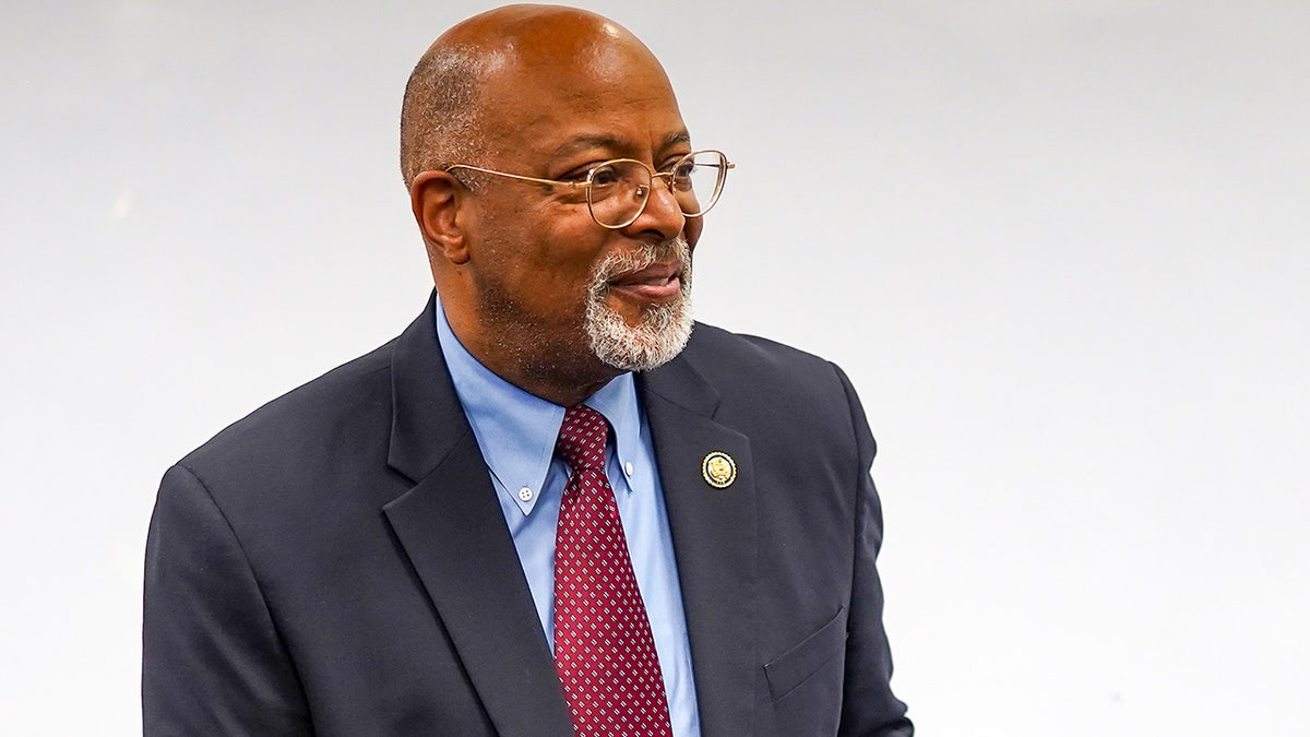 Glenn Ivey stands in a hallway