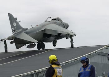 A British Sea Harrier jet taking off.
