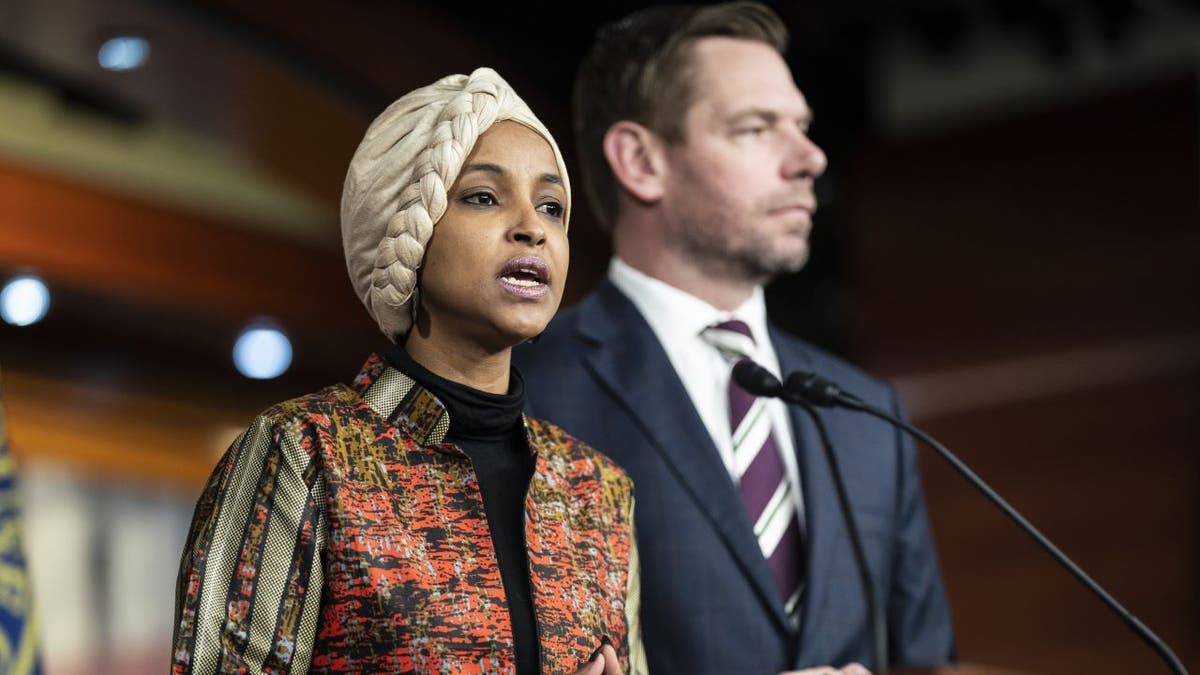 Ilhan Omar stands with Eric Swalwell